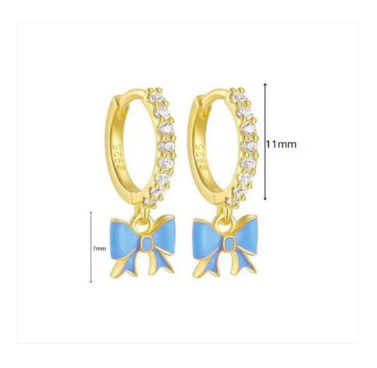 Bow hoop earrings featuring 14k gold over sterling silver with blue bows and clear cubic zirconia, elegant design.