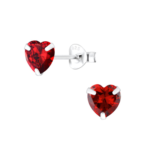Heart stud earrings featuring 6mm red cubic zirconia hearts set in 925 sterling silver with secure push back closures.