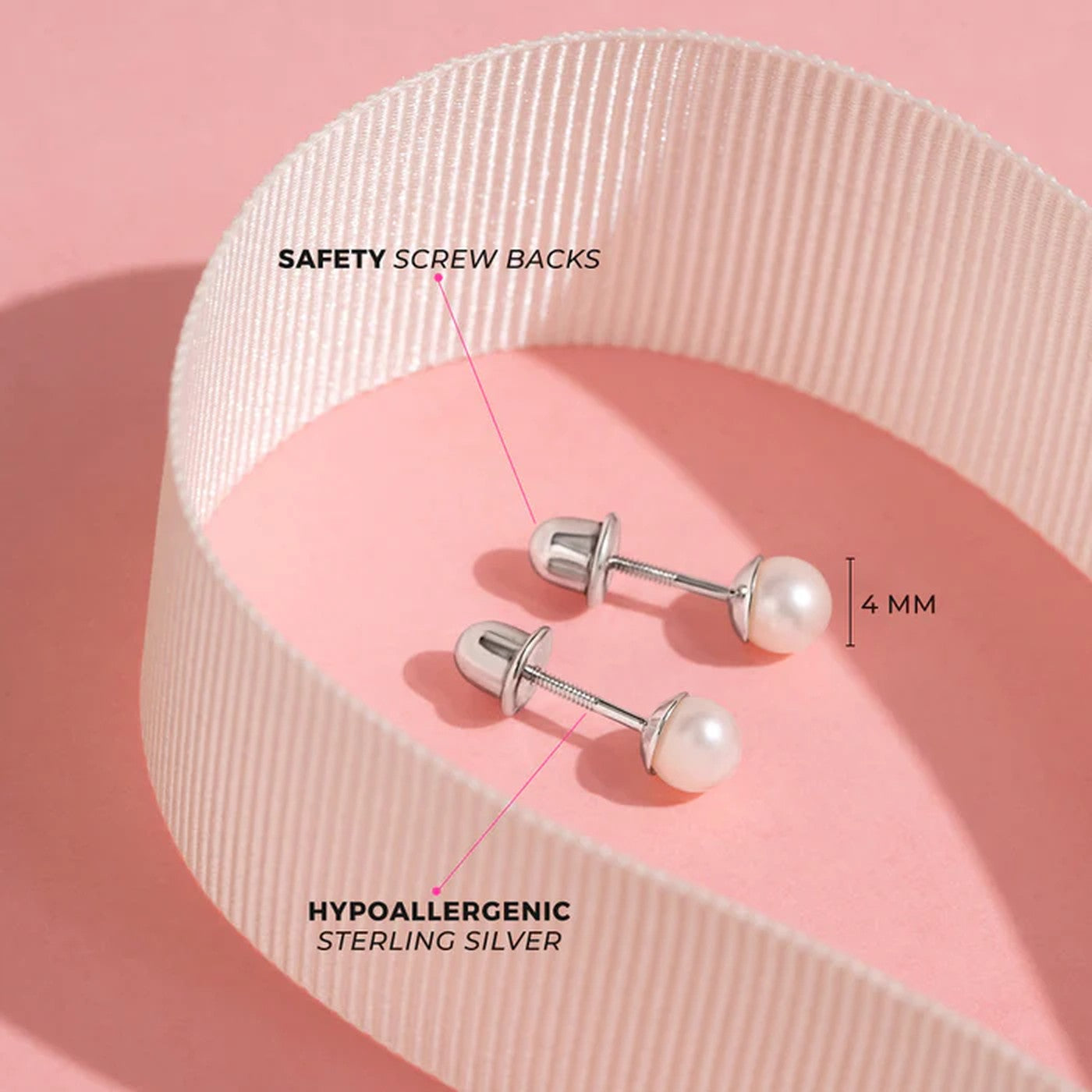 A pair of 4 mm pearl stud earrings with screw-back posts made of hypoallergenic sterling silver, displayed on a pink surface with a curved white ribbon, labelled ‘Safety Screw Backs’ and ‘Hypoallergenic Sterling Silver.
