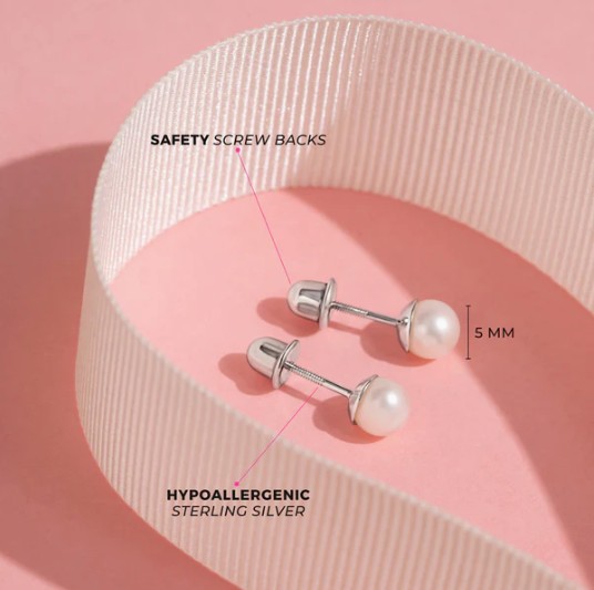 Pearl earrings with safety screw backs on a pink ribbon background