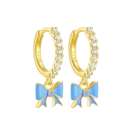 Bow hoop earrings made with 14k gold over sterling silver featuring blue bows and clear cubic zirconia embellishments.