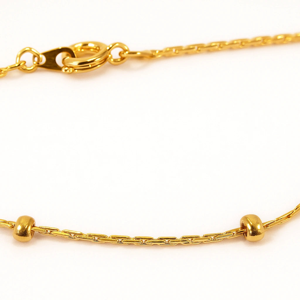 Children's anklet made of gold plated material featuring tiny gold studs, perfect for everyday wear and special occasions.