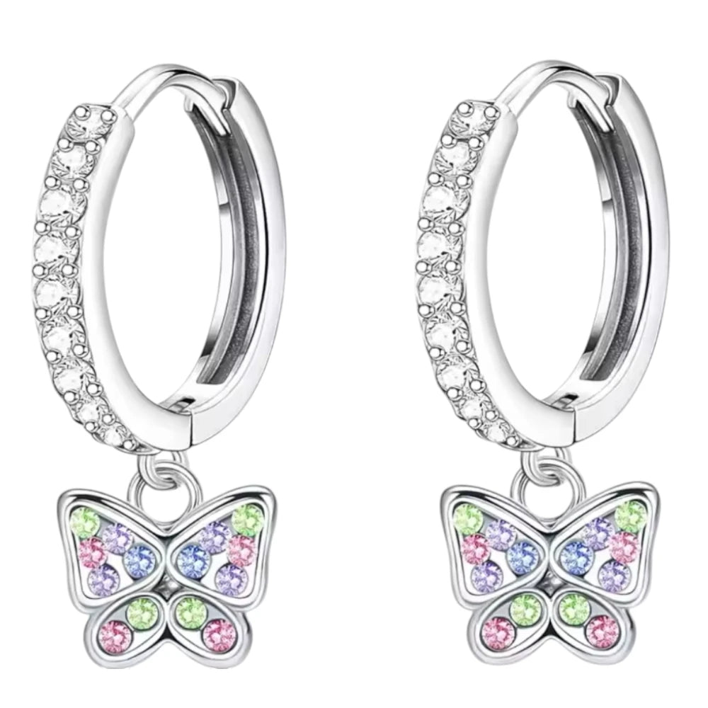 Children's earrings featuring 316L surgical steel huggie hoops and colorful butterfly charms with cubic zirconia.