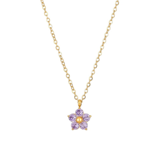 Flower necklace with a gold chain and purple cubic zirconia flower pendant