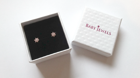 Gold heart earrings in a gift box from Baby Jewels, showcasing elegant design and premium quality craftsmanship.