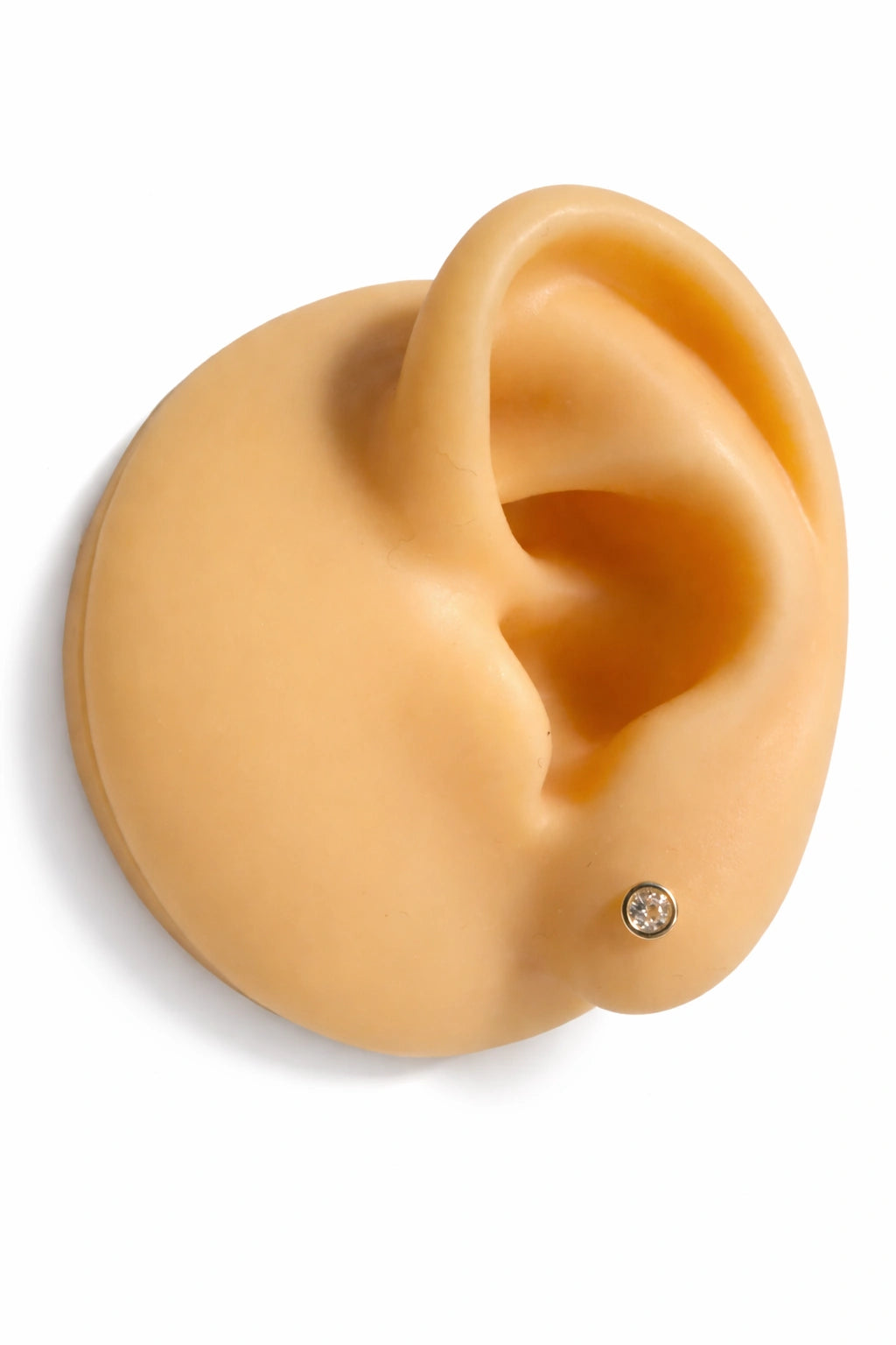 baby earrings displayed on a realistic ear model showcasing 14k gold and CZ design.