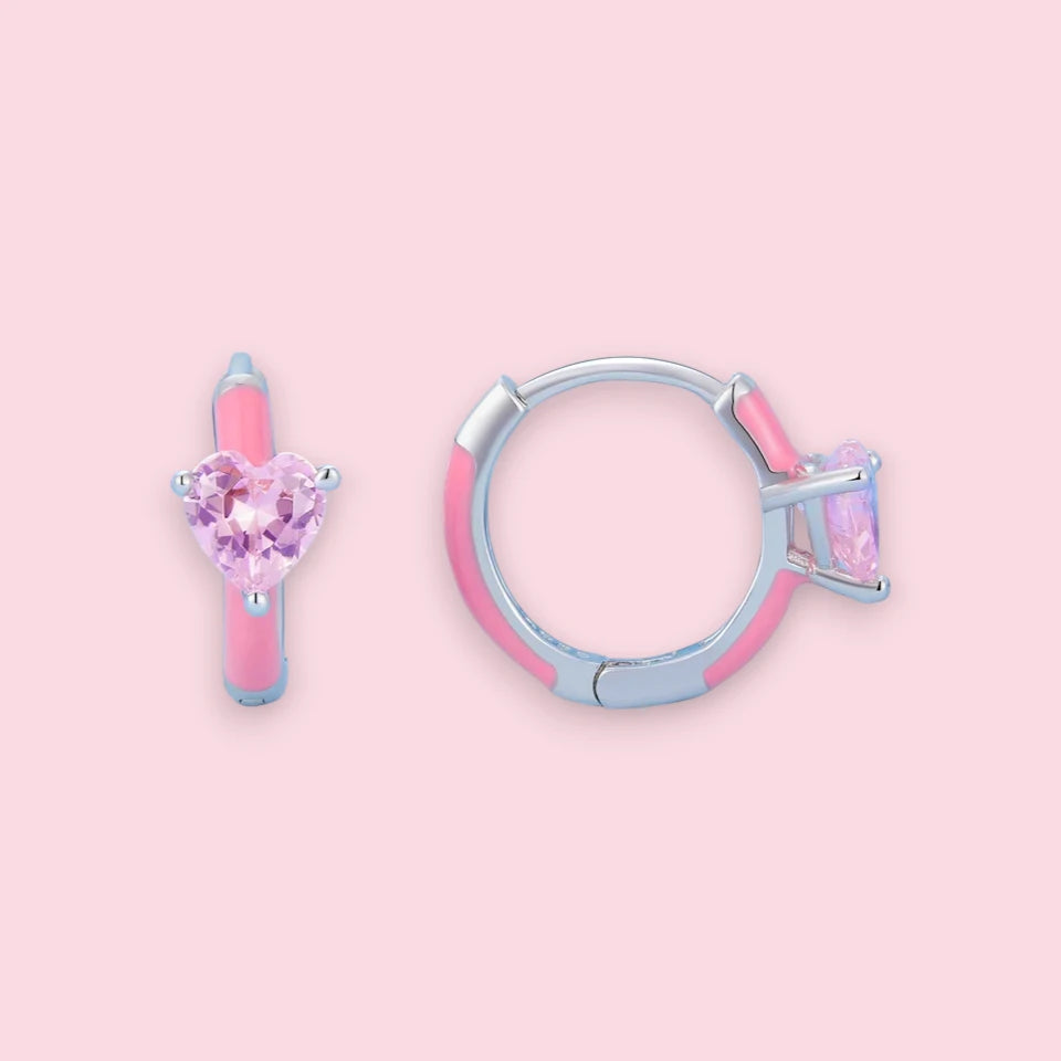 Heart hoop earrings featuring pink enamel and sparkling cubic zirconia, crafted in 925 sterling silver.