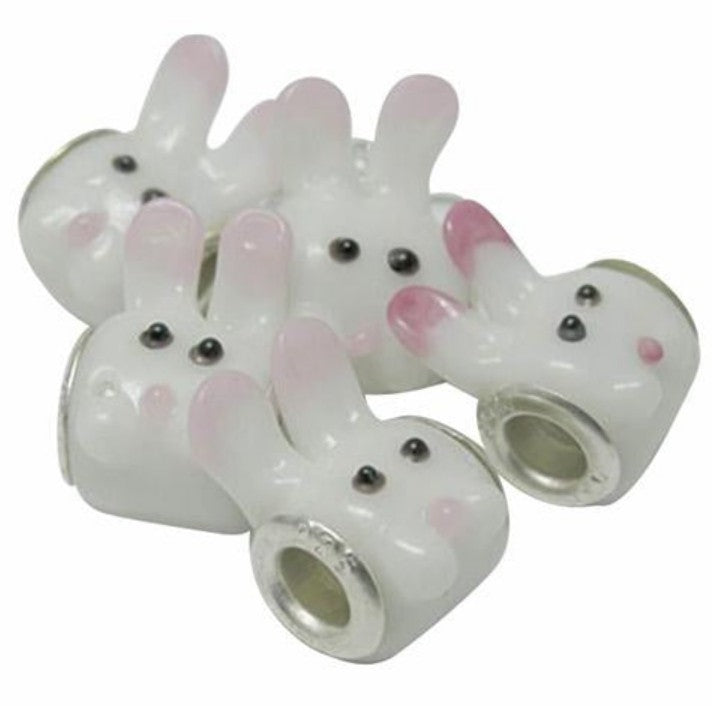 glass bunny rabbit charm beads with silver plated cores on a white background