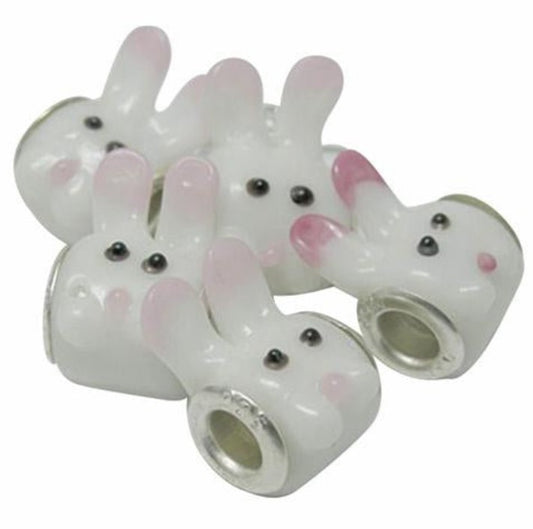 glass bunny rabbit charm beads with silver plated cores on a white background