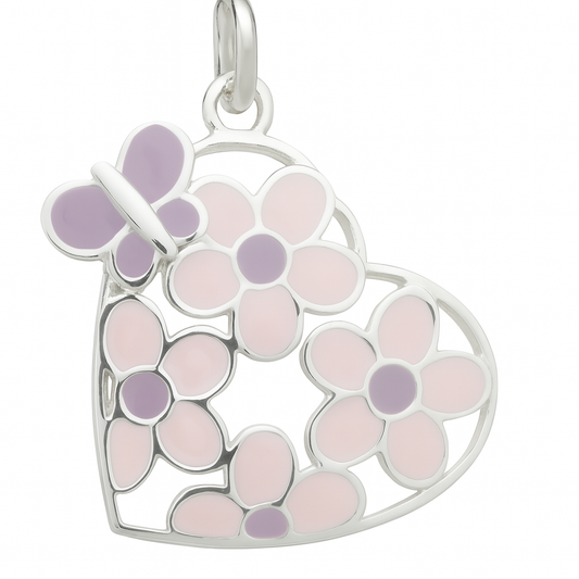 Close-up product image of a heart-shaped silver pendant with pink and purple enamel flowers and a butterfly, displayed against a plain white background