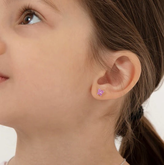 Young girl wearing butterfly earrings - hypoallergenic sterling silver for kids