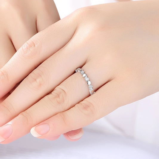 Sterling silver star ring worn on hand, featuring polished stars and cubic zirconia accents.