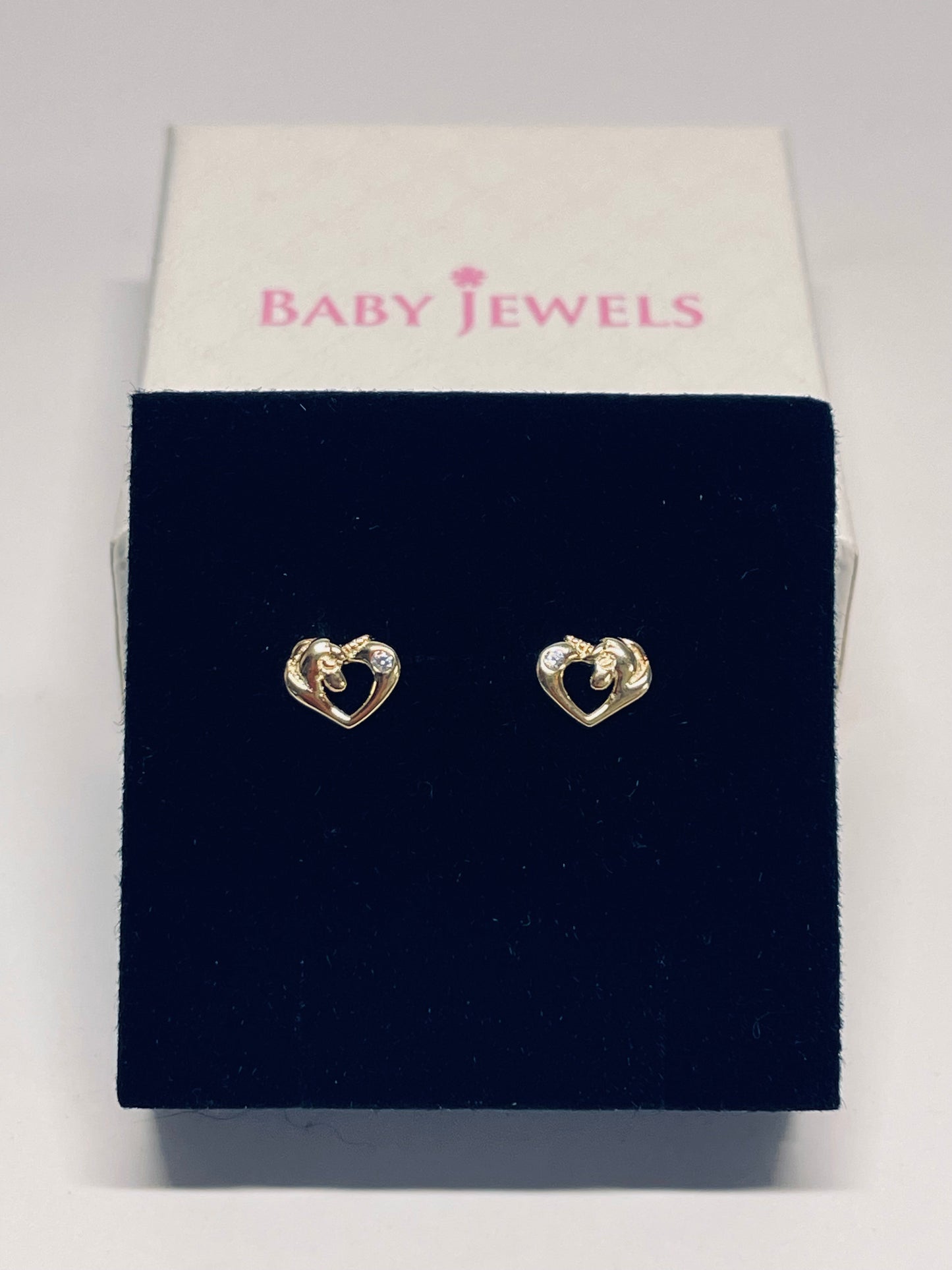 Unicorn earrings - 14k gold over silver unicorn CZ screw back studs displayed in a gift box.