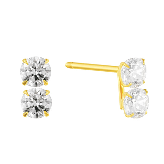 Gold stud earrings with clear gemstones on a white background