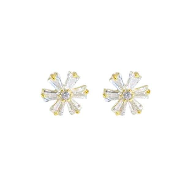 Pair of gold and clear crystal stud earrings on a white background