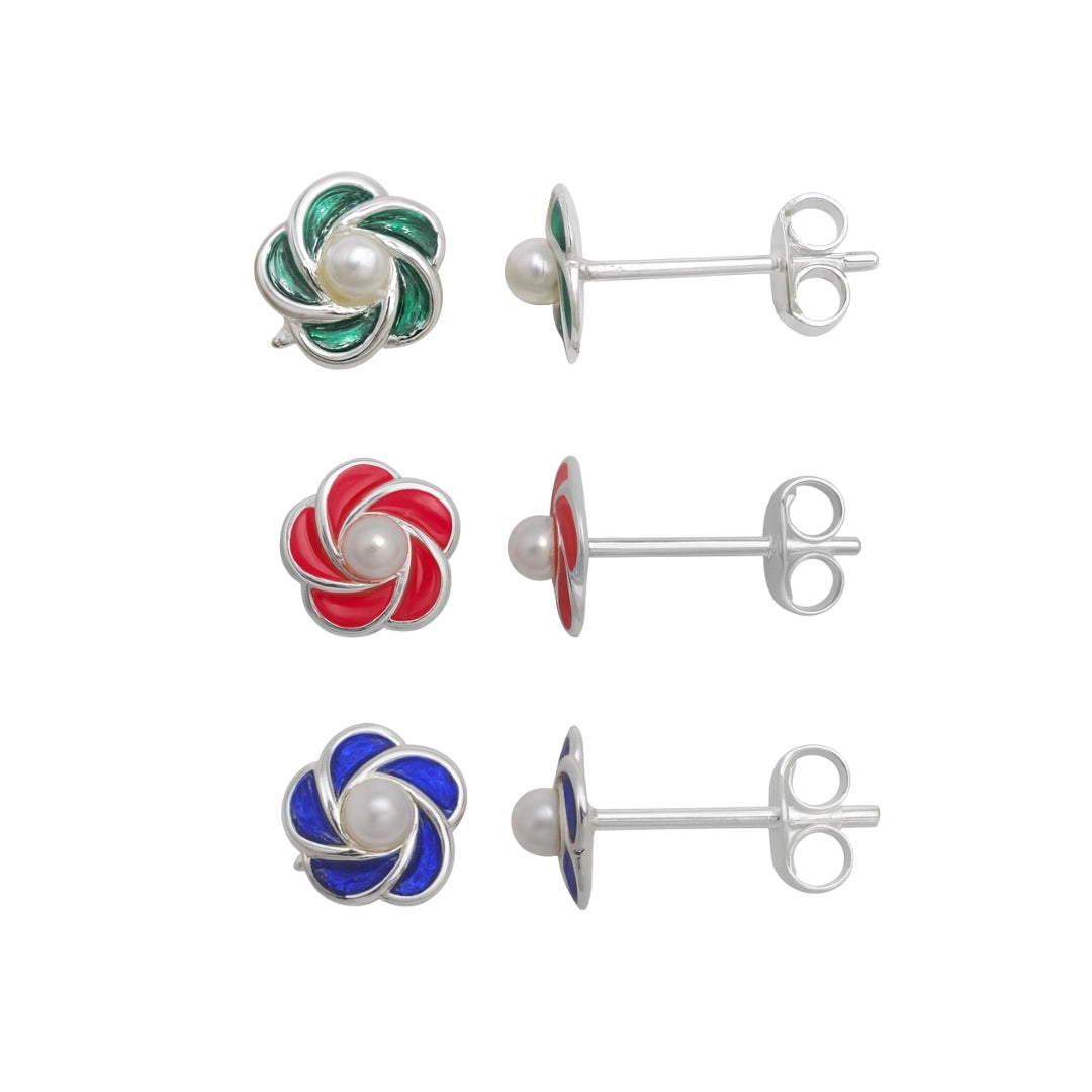 Set of four earrings with colorful swirl designs and pearl centers on a white background