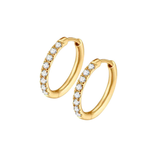 Close‑up of a pair of small gold‑plated hinged hoop earrings, each front half encrusted with a neat row of clear round gemstones and featuring a smooth click‑shut closure