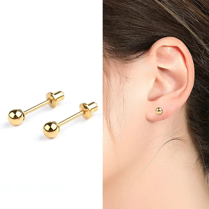 split image with A pair of polished surgical steel 4mm ball stud earrings with screw backs and yellow gold ionic plating on the left and a close up of the ball studs in the ear of a young girl on the right