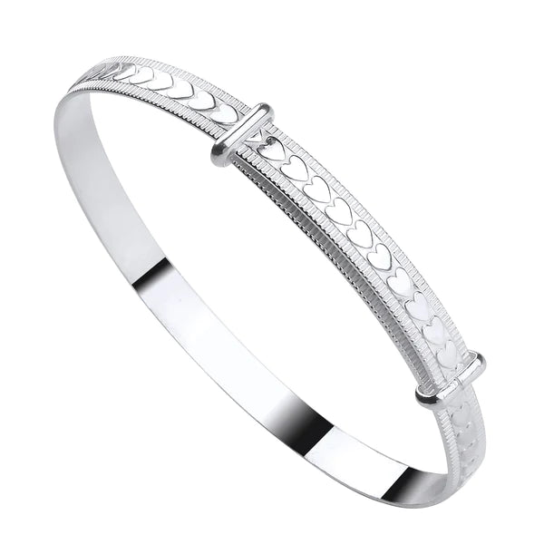 A sterling silver children's bangle with embossed hearts and a bead border, adjustable closure.