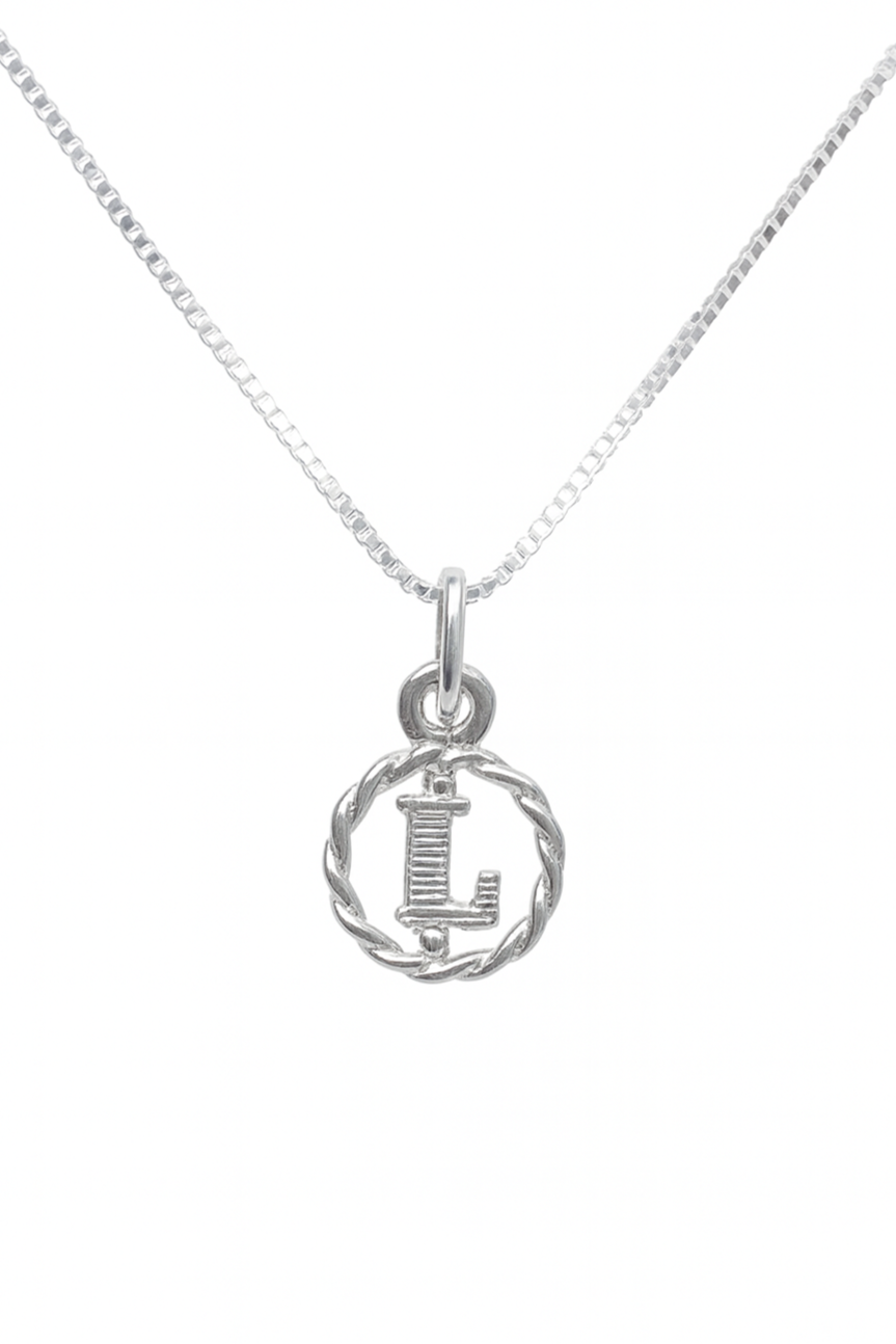 Silver necklace with a round pendant featuring the letter 'L' on a white background