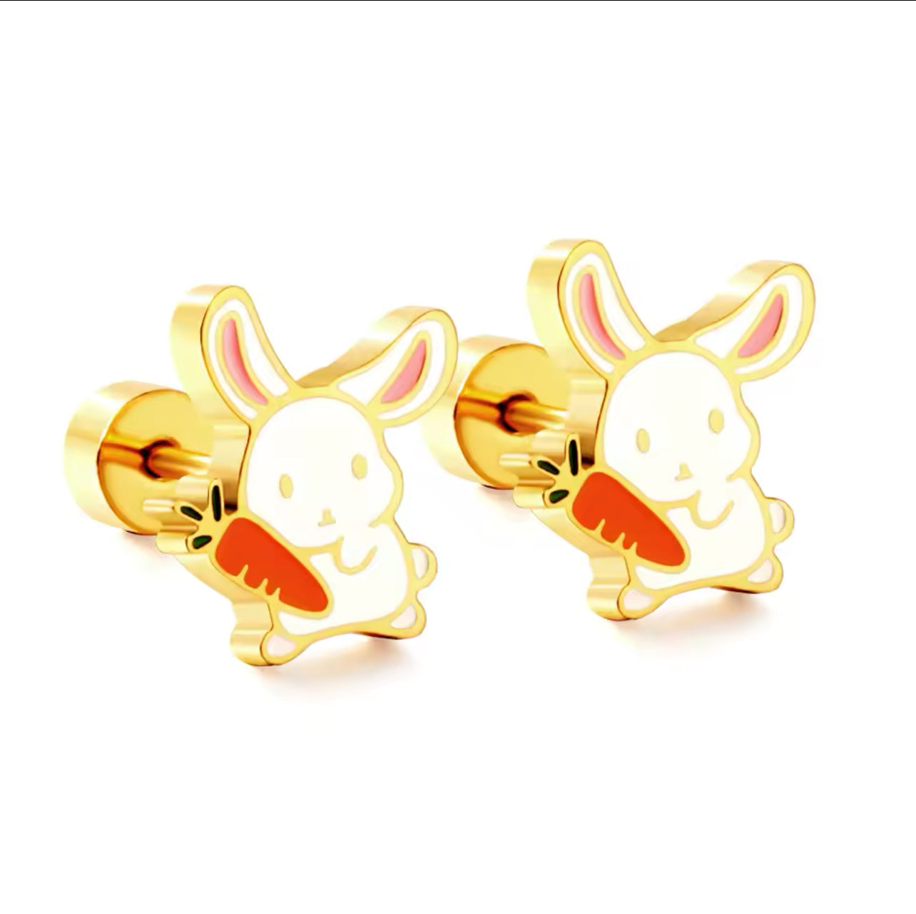 A pair of gold-colored surgical steel earrings designed as bunny rabbits with carrots.