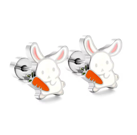 A pair of surgical steel bunny rabbit earrings with screw back closures, depicted holding carrots.