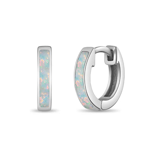 A pair of sterling silver children's earrings with opal inlaid huggies.