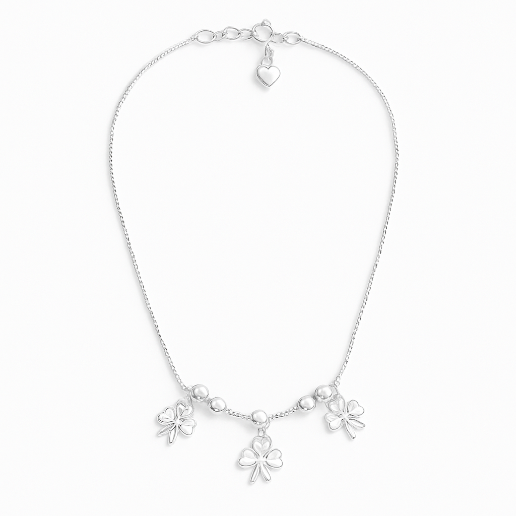 sterling silver clover charm anklet on a white background
