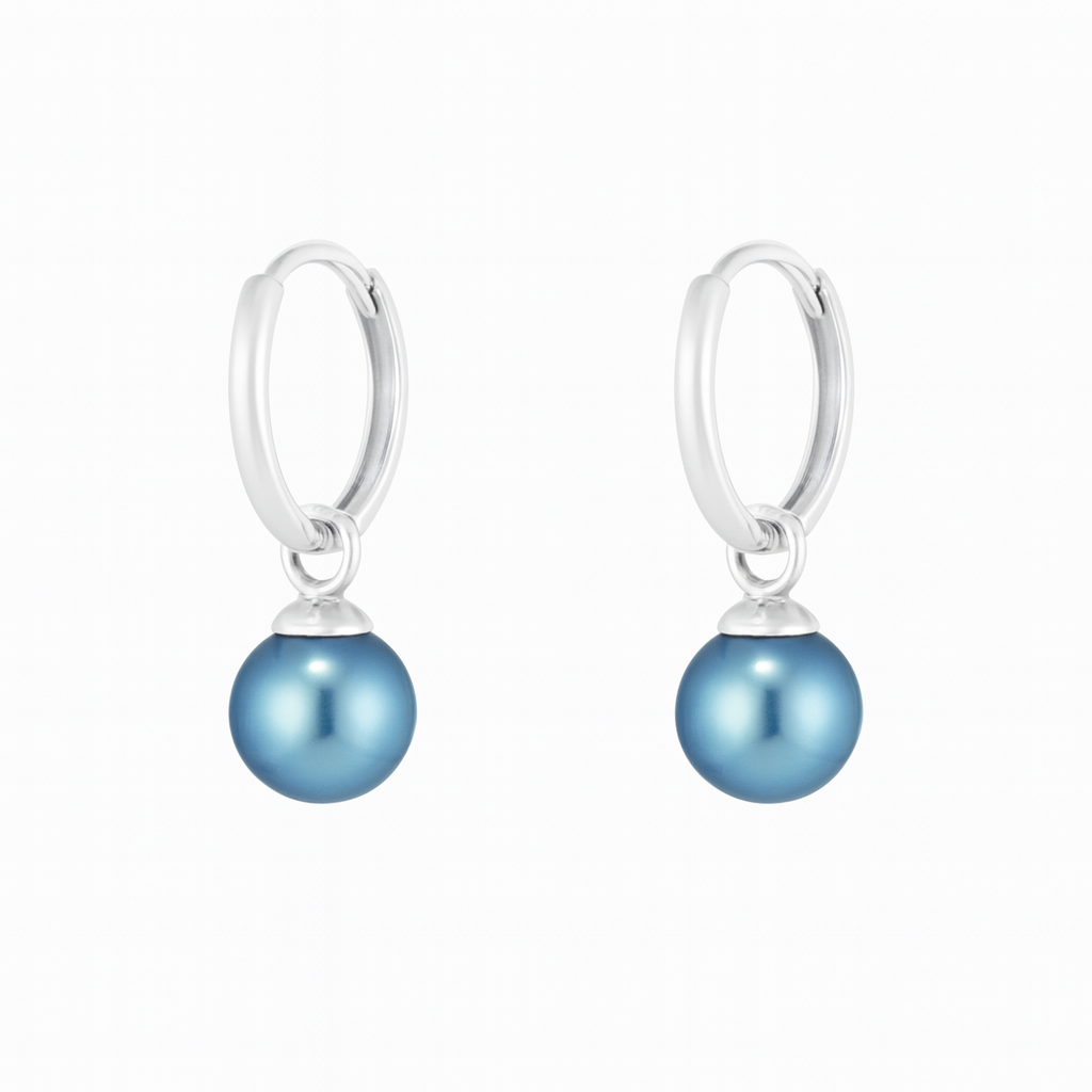 Pair of silver earrings with blue pearl drops on a white background