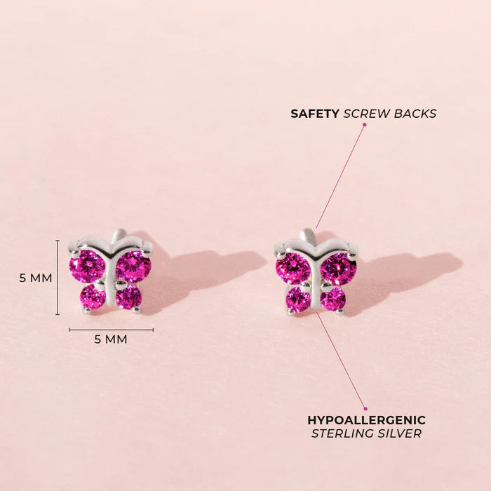 product image of sterling silver children's butterfly stud earrings with dimensions of 5 by 5 mm on a light pink background