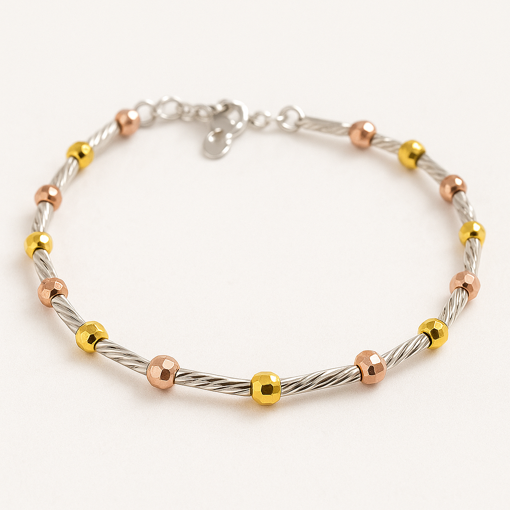 Children’s tri-colour beaded bracelet with alternating twisted silver rods and polished gold and rose-gold beads, arranged in a circle on a soft, nearly white background.