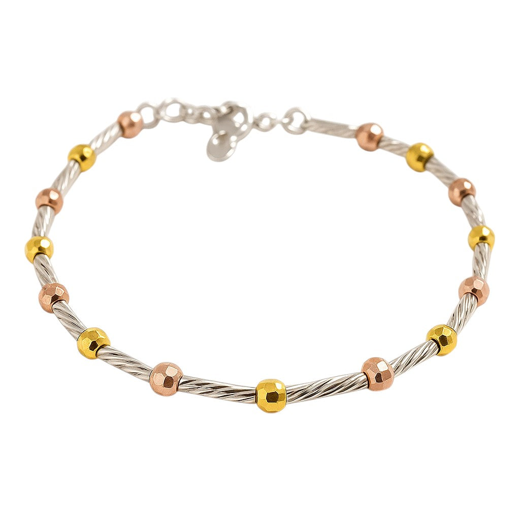 Bracelet with gold, rose gold, and silver beads on a white background