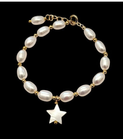 Elegant pearl bracelet with 14k gold plated freshwater pearls and natural shell star centerpiece.