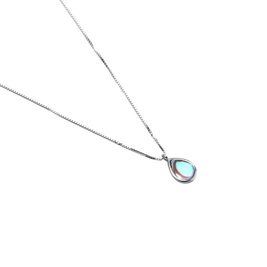 Teardrop-shaped moonstone pendant on a silver chain, displayed on a plain white background.