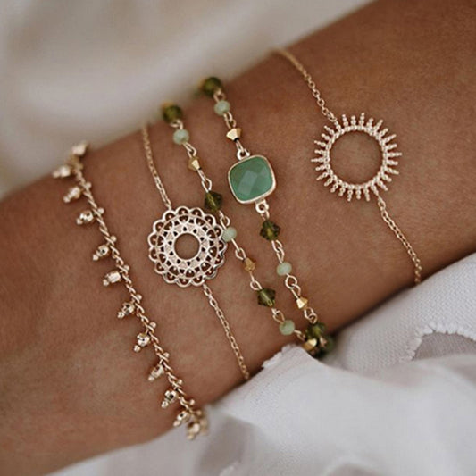 Layered bracelet - 3-piece green crystal layered bracelet set styled on a wrist to create a chic layered look.