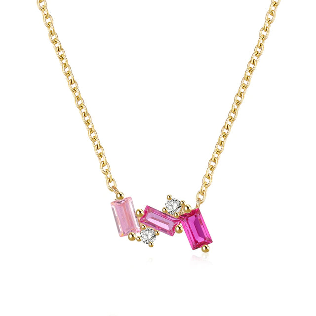 Sterling silver pink cz necklace featuring three shades of pink baguettes and clear CZ accents.