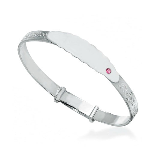 Silver expanding baby bracelet with embossing and name plate featuring a single pink cz stone on a white background