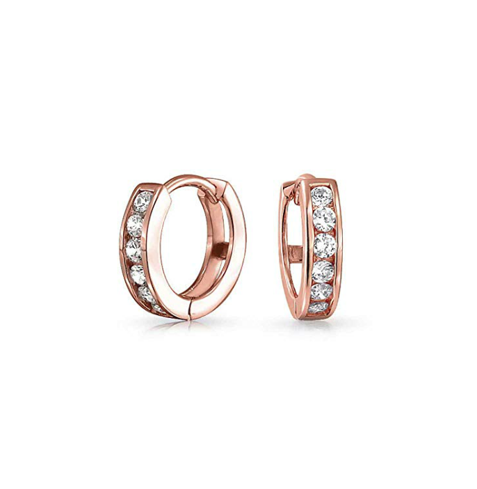 Rose gold CZ huggies featuring sparkling white AAA cubic zirconia in surgical steel.