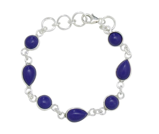 A sterling silver baby bracelet with deep blue Lapis stones, featuring a chain-link design and a lobster clasp closure.