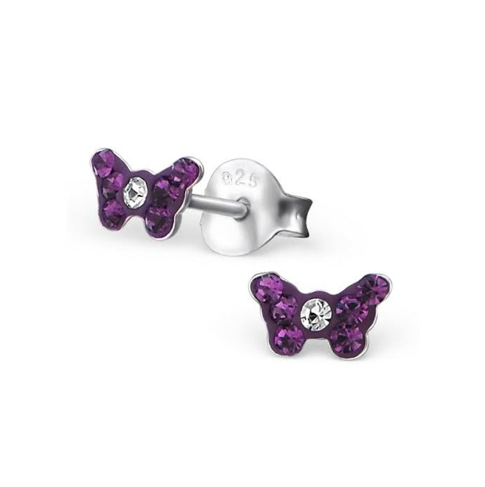 A pair of sterling silver children's earrings in the shape of butterflies, with the butterfly's body represented by a purple crystal in the center, and wings with purple crystal tiles.