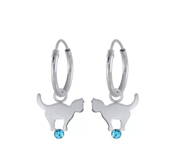 A pair of sterling silver sleepers with kitty cat charms balancing on blue cubic zirconia balls