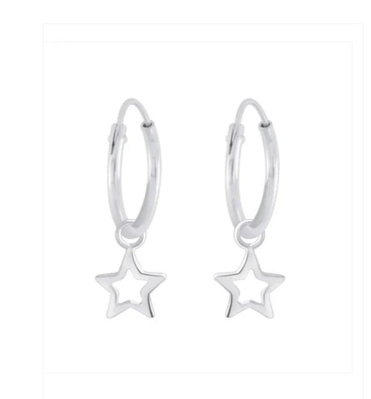 A pair of children's earrings made of sterling silver, featuring open star shapes as the dangle design.