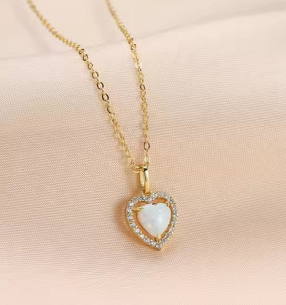 14k gold Plated heart halo necklace featuring a White Fire Opal heart and CZ accents on a gold chain.