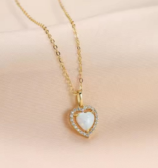 14k gold Plated heart halo necklace featuring a White Fire Opal heart and CZ accents on a gold chain.