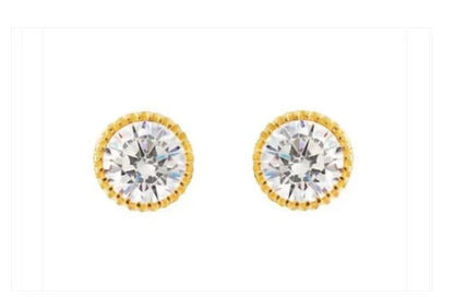 A pair of 14k gold crimped, bezel framed AAA CZ screw back earrings on a white background.