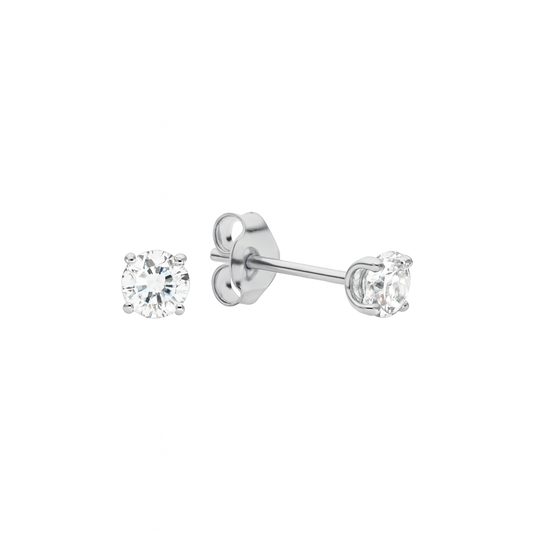 A pair of 14k white gold baby earrings with clear, 4 prong 3mm solitaire CZ, with push back closures, displayed on a white background.