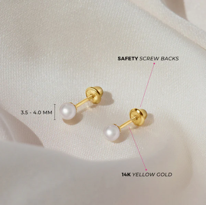 Gold earrings with pearl beads on a light background, showing safety screw backs and gold content.