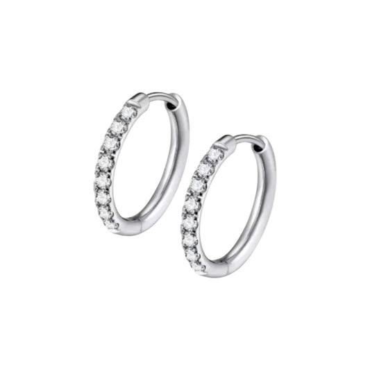 Close‑up of a pair of small silver‑tone hinged hoop earrings, each front half encrusted with a neat row of clear round gemstones and featuring a smooth click‑shut closure.