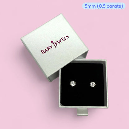 Moissanite earrings in a silver box, showcasing 5mm (0.5 carats) design. Perfect for elegant gifting and every occasion.