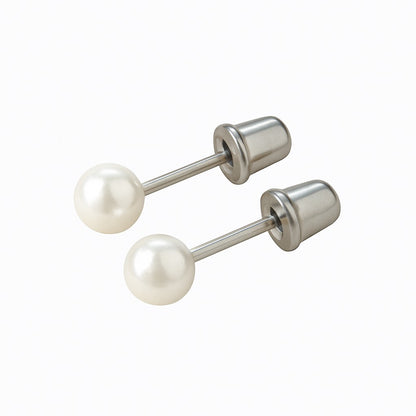 Pair of pearl stud earrings on a white background